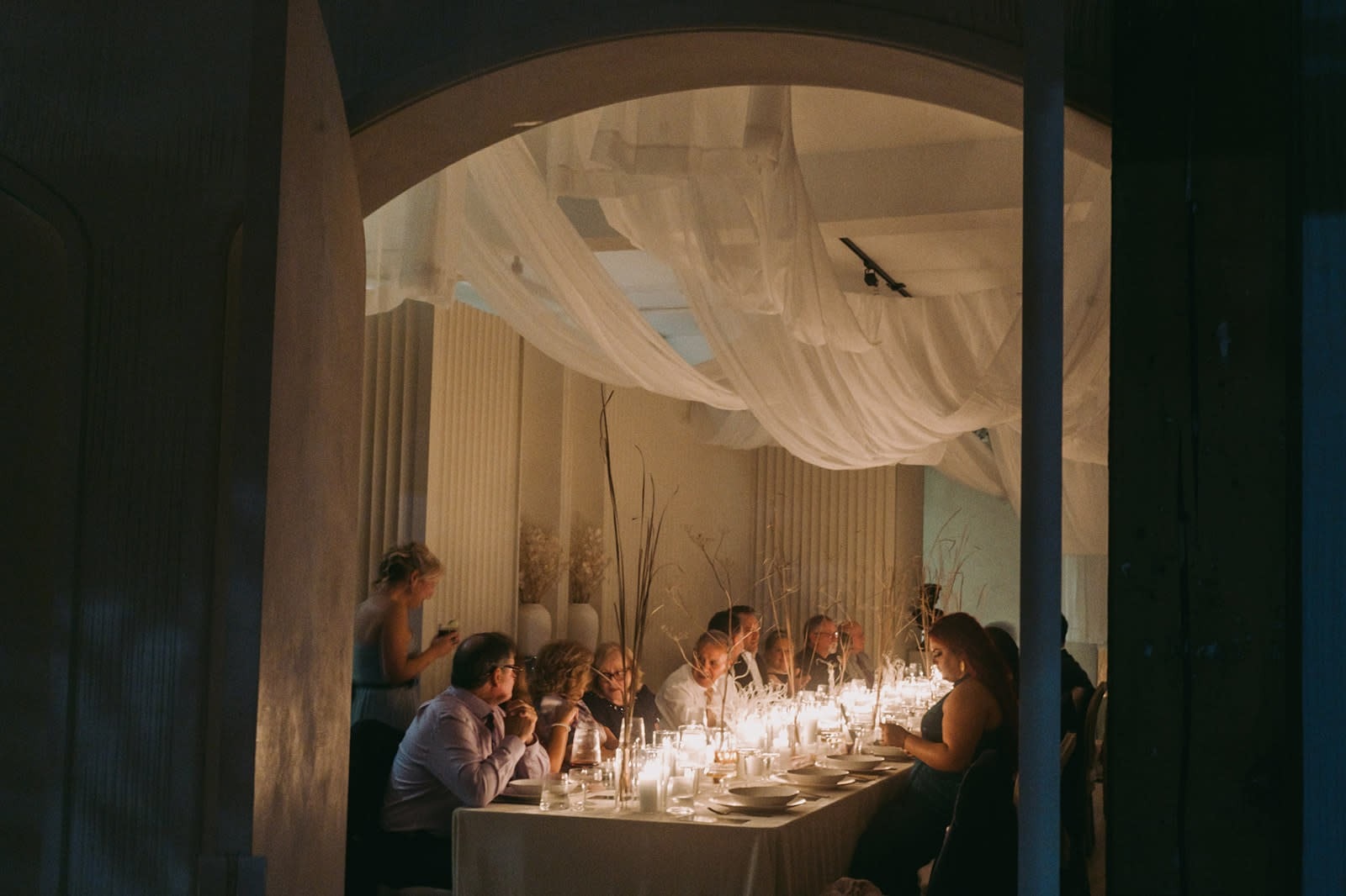 Intimate candlelit dinner reception table setting for elegant Jacksonville wedding event