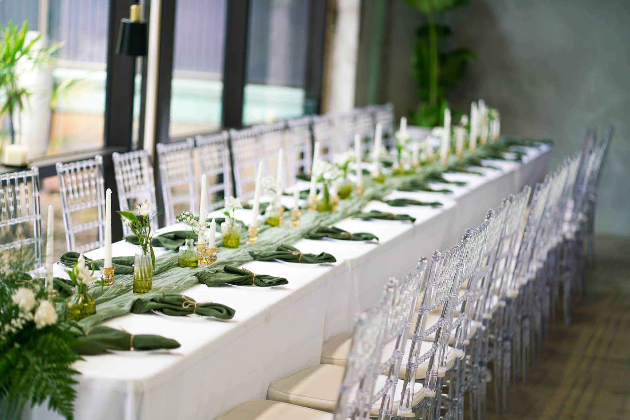 Elegant long table setup with greenery designed by Minneapolis wedding planners
