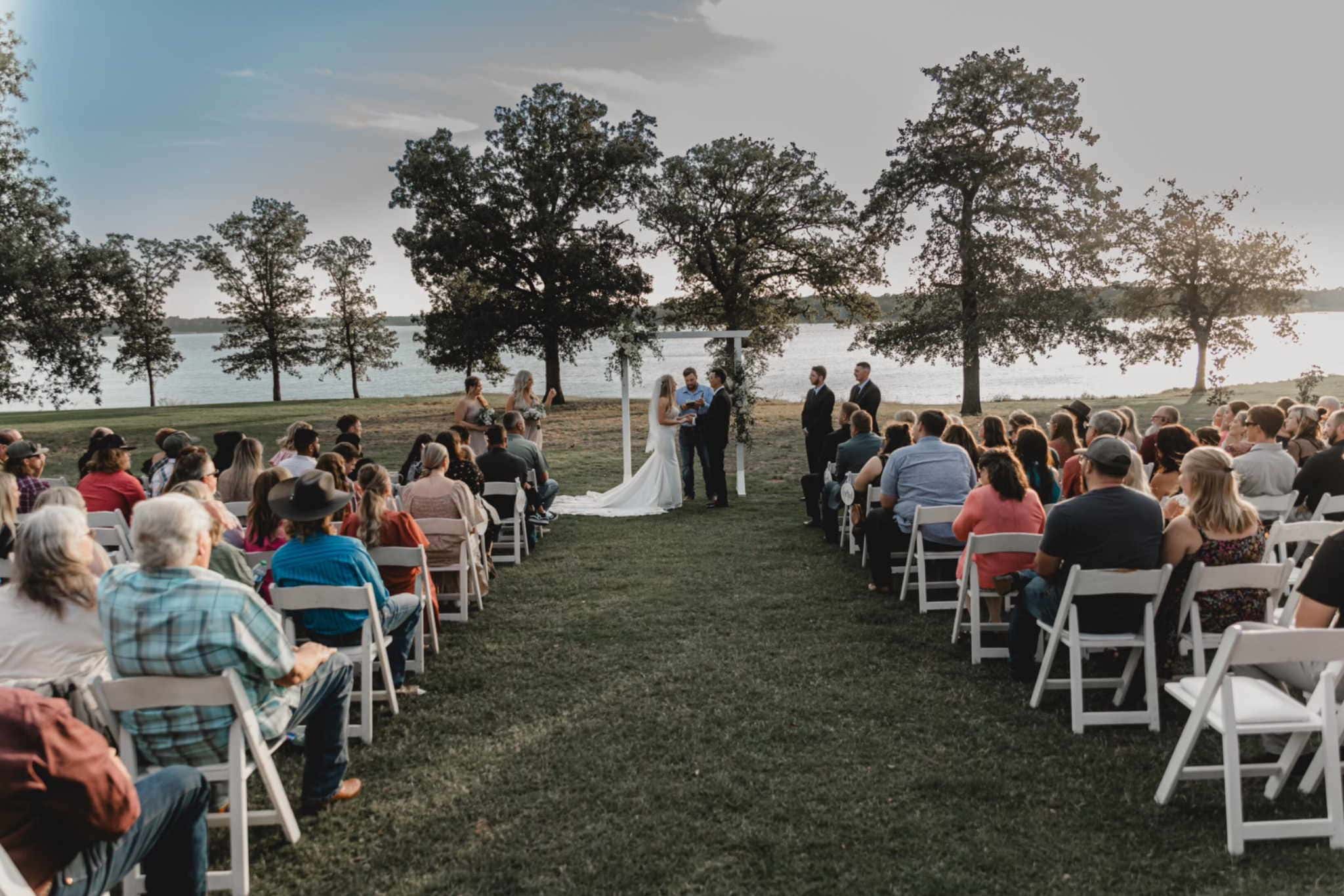 Guests attend scenic waterfront outdoor wedding ceremony planned in Oklahoma