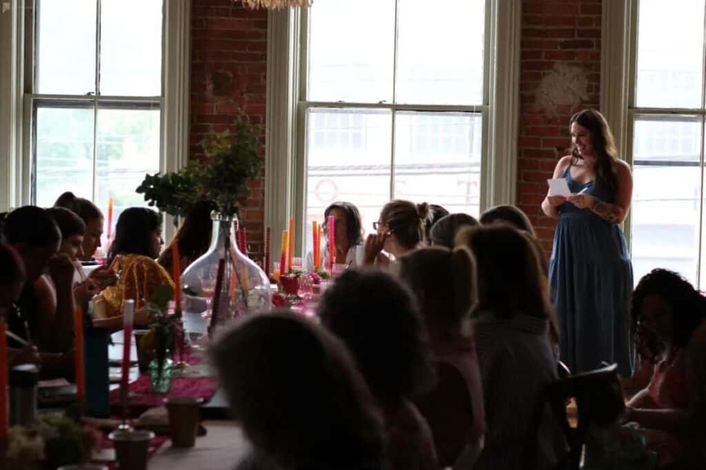 woman giving a toast at a bridal shower