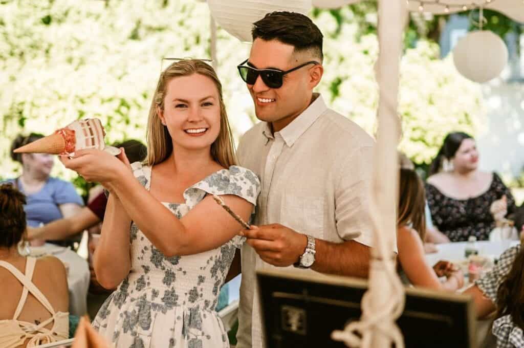 a bride and groom opening gifts at a bridal shower