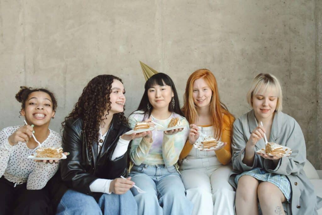 girls eating birthday cake at party